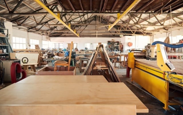 Manufacturers represented by image of a medium size wood shop with tools, lathes, and table saws.